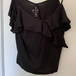 Black crop top, has ruffles on front that cross onto the v-neck.